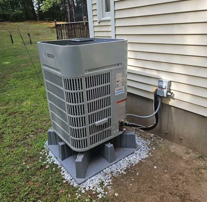 Bosch inverter heat pump installed on raised pad at Tyngsborough MA home